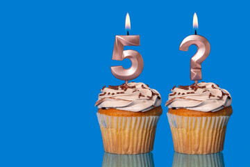 Birthday Cupcakes with Lit Number 5 and Question Mark candle