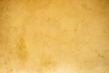 Fototapeta premium Gold texture design element blurred background glittering. Golden pattern backdrop decoration with copy space. Magic yellow orange shiny glowing selective focus. Glamour effect gold antique defocused