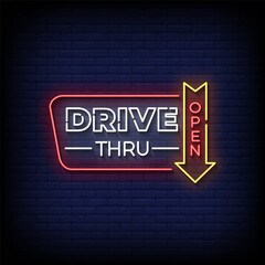 Obraz premium drive thru neon Sign on brick wall background vector