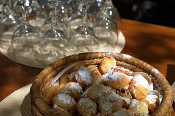 Traditional Dalmatian cookies in wicker basket on rustic table