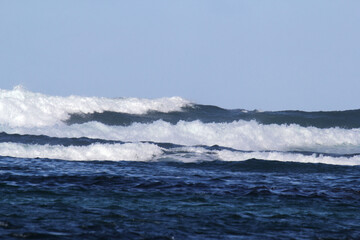 Seascape with multiple waves breaking in the ocean