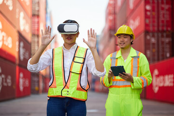 worker or engineer wearing virtual reality glasses(VR) in containers warehouse storage