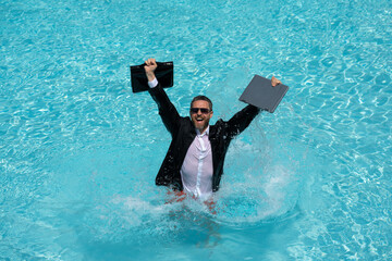 Summer business. Freelancer in swimming pool. Business man in wet suit in swimming pool. Crazy...
