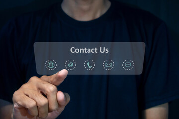 A man touching on virtual screen contact icons. Contact us, call center, hotline operator or...