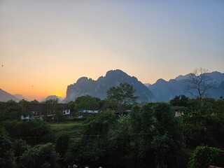 sunset in the mountains in Vang Vieng, Laos 