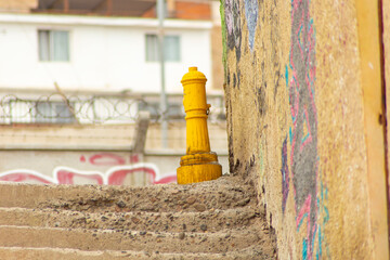 street photography, showing a yellow faucet