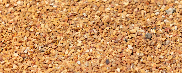Small orange crushed stone. As a background