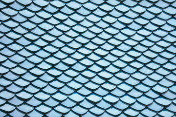 Fototapeta premium Blue tiles on the roof as an abstract background. Texture