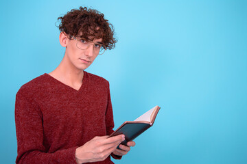 A funny guy who is trying to learn. Blue background.