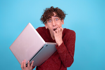 A funny guy who is trying to learn. Blue background.