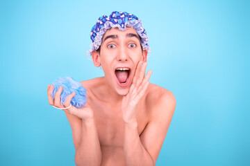 Funny guy takes a shower. Blue background.