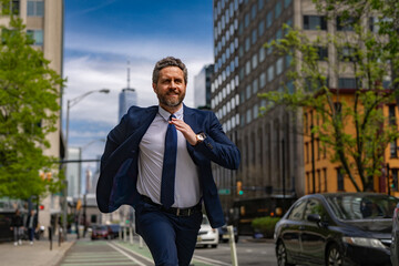 Business man in suit run in NY. American business. Businessman run down street, late for a meeting. Businessman in suit run be success. Running business man. Fast business. Run and late businessman.