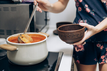 Red Ukrainian borscht on the table. Cooking the national first course