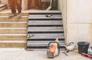 Concrete steps under construction builders install heavy concrete blocks