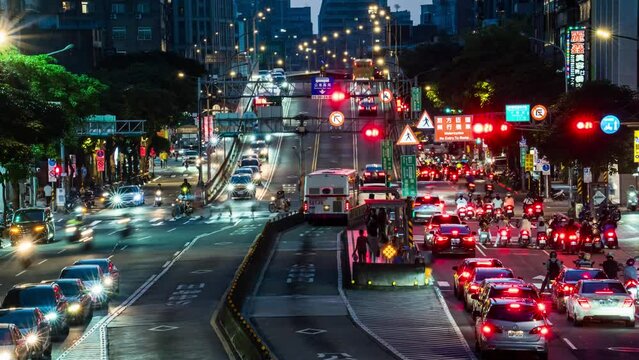 Time-lapse photography, busy traffic on the bus lane under the bridge at dusk during rush hour, cars and motorcycles, Taipei Taiwan Asia
