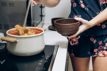Red Ukrainian borscht on the table. Cooking the national first course
