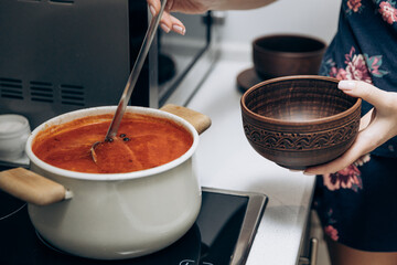 Red Ukrainian borscht on the table. Cooking the national first course