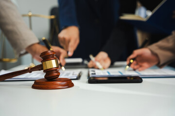 Teamwork of business lawyer meeting working hard about legal legislation in courtroom to help their...