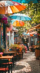 Obraz premium A row of tables lined up with umbrellas shading them, creating a cozy outdoor dining area. Each table is set with chairs, ready for guests to enjoy a meal or drinks under the shade.