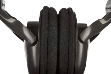 Closeup photo of black vintage audio headphones on white background, Audio nostalgia: Worn...