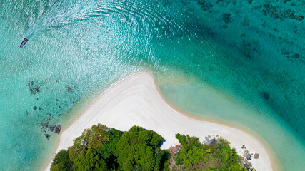 The white sand beach tropical with seashore as the island in a coral reef ,blue and turquoise sea Amazing nature landscape with blue lagoon