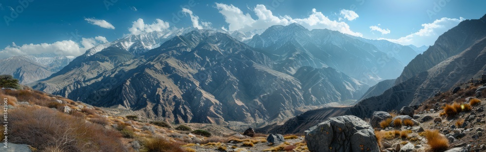 Aufkleber a mountain range with a clear blue sky. the mountains are covered in snow and the sky is bright and 