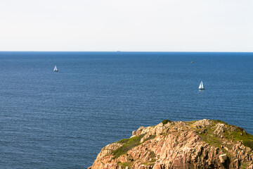Serene Coastal Landscape with Sailboats