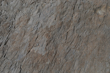 Stone texture worn by the wind and the sea of ​​the coast located on a wild beach.