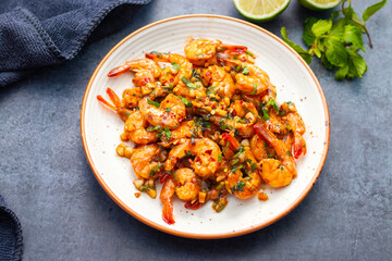 selective focus of Butter Garlic Prawn with a black background. 