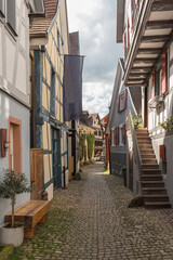 Alley with cobblestones and half-timbered houses in the historic old town of Gengenbach, Kinzigtal,...