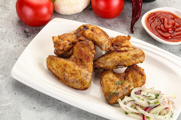 Grilled chicken wings with sauce