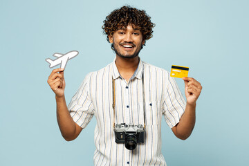 Traveler Indian man wear white casual clothes hold credit card airplane mockup isolated on plain...