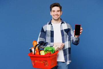 Young man wears shirt white t-shirt casual clothes hold basket bag for takeaway with food products...