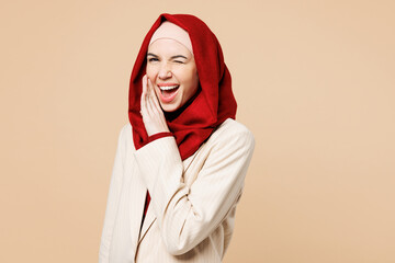 Young Arabian Asian Muslim woman wear red abaya hijab suit clothes scream sharing hot news about...