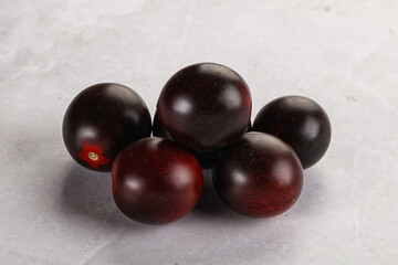 Raw ripe black kumato tomato