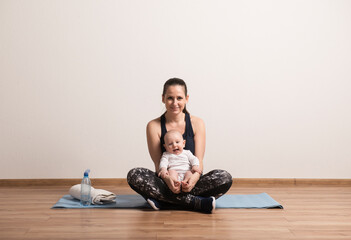 Home exercise for mother and baby, mommy and me workout. Physical activity for mother while bonding...