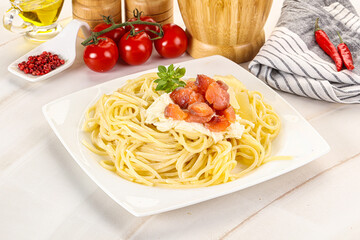 Pasta spaghetti with salmon and stracciatella