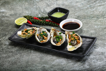 Open half oysters with green onion