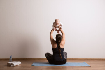 Home exercise for mother and baby, mommy and me workout. Physical activity for mother while bonding...