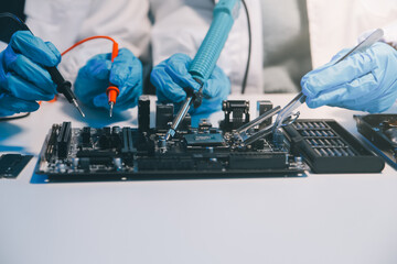 Close up of Technician measuring voltage electronic circuit board television, Service after sale...