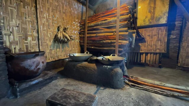 Traditional Indonesian cooking room with furnace and pile of firewood. traditional kitchen