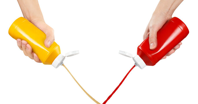 Hands squeezing ketchup and mustard out of plastic bottles, cut out