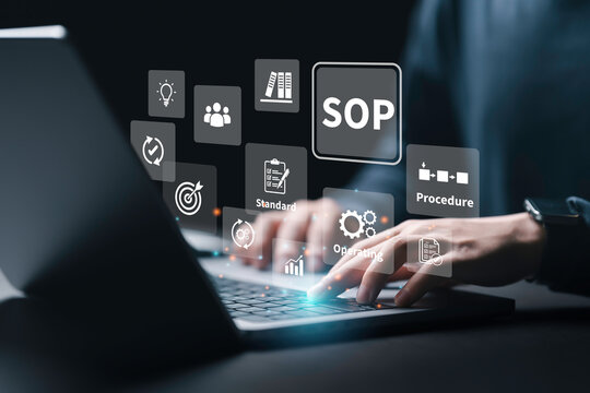 SOP Standard Operating Procedure business concept. Businessman using a computer to design workflow for Instructions to assist employee in complex routine operations.