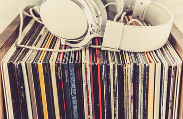 Stack of old vinyl records on the table. Retro style toned image
