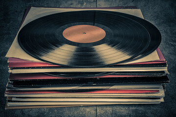 Vintage vinyl records on a grunge background. Toned.