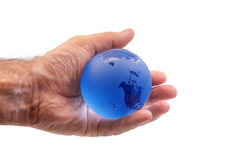 a man's hand with skin condition that causes loss of melanin holds a crystal ball of the Earth in the palm