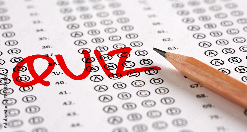 Wall mural close up view of a test exam paper with the word quiz and a pencil.