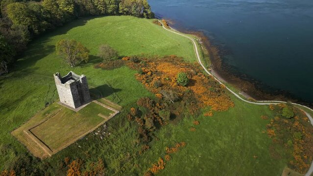 Aerial shot of Strangford Lough in County Down, Northern Ireland.

Filmed on a sunny day, the camera moves backwards over Audley's Castle.

Produced in 4K, 60fps and in Rec709 color space.