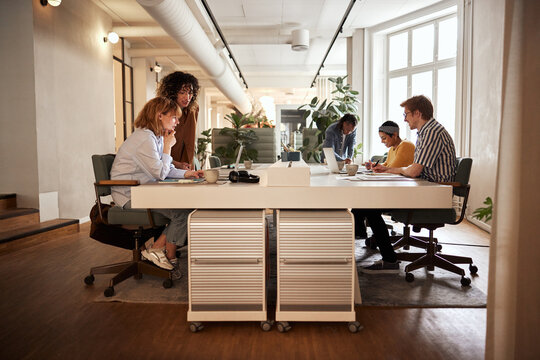 Diverse businesspeople working at an office table