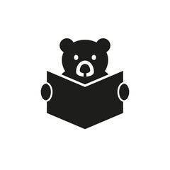 Bear with glasses reading a book and holds her in his paws. Vector silhouette on white background.
